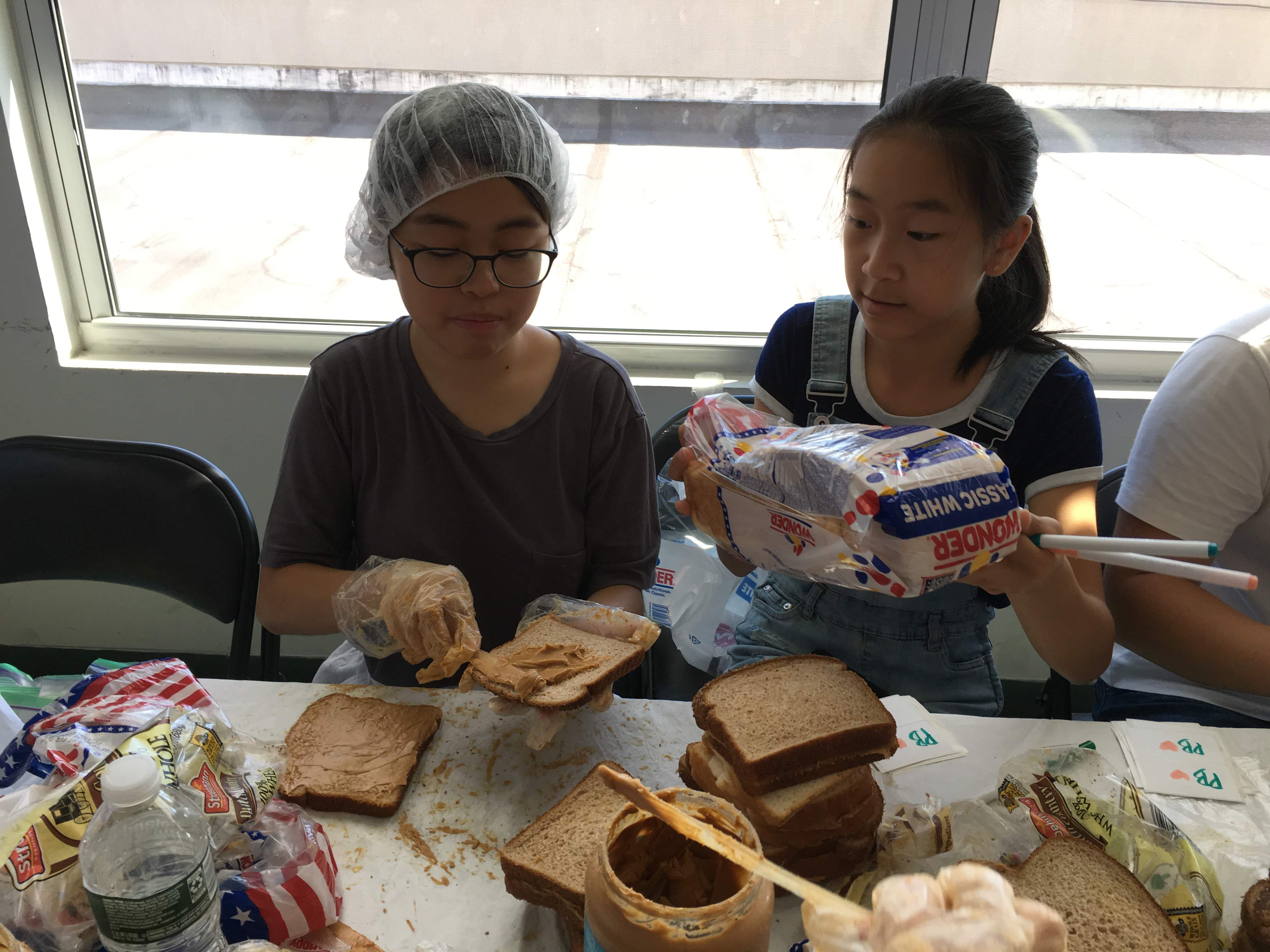 Service Learning participants pass out food