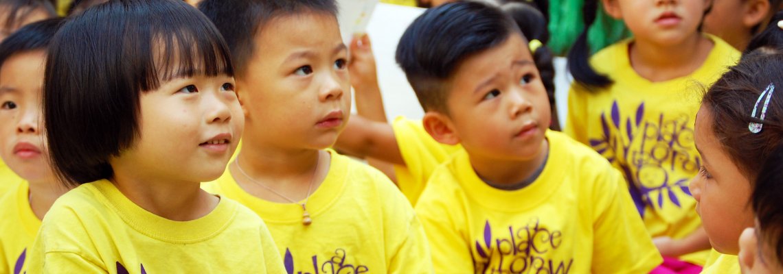 Children from the Little Star Stepping Up wearing yellow