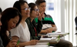 Adult Literacy Program - Student Smiling in Classroom