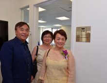 Tai Wang and friends in front of the Glow Foundation Classroom